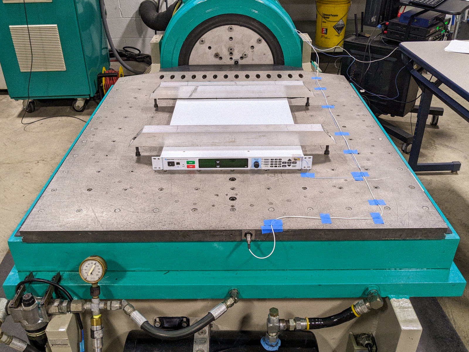 Magna-Power's SLx Series mounted on an accelerometer at the independent testing laboratory undergoing RTCA/DO-160G vibration testing