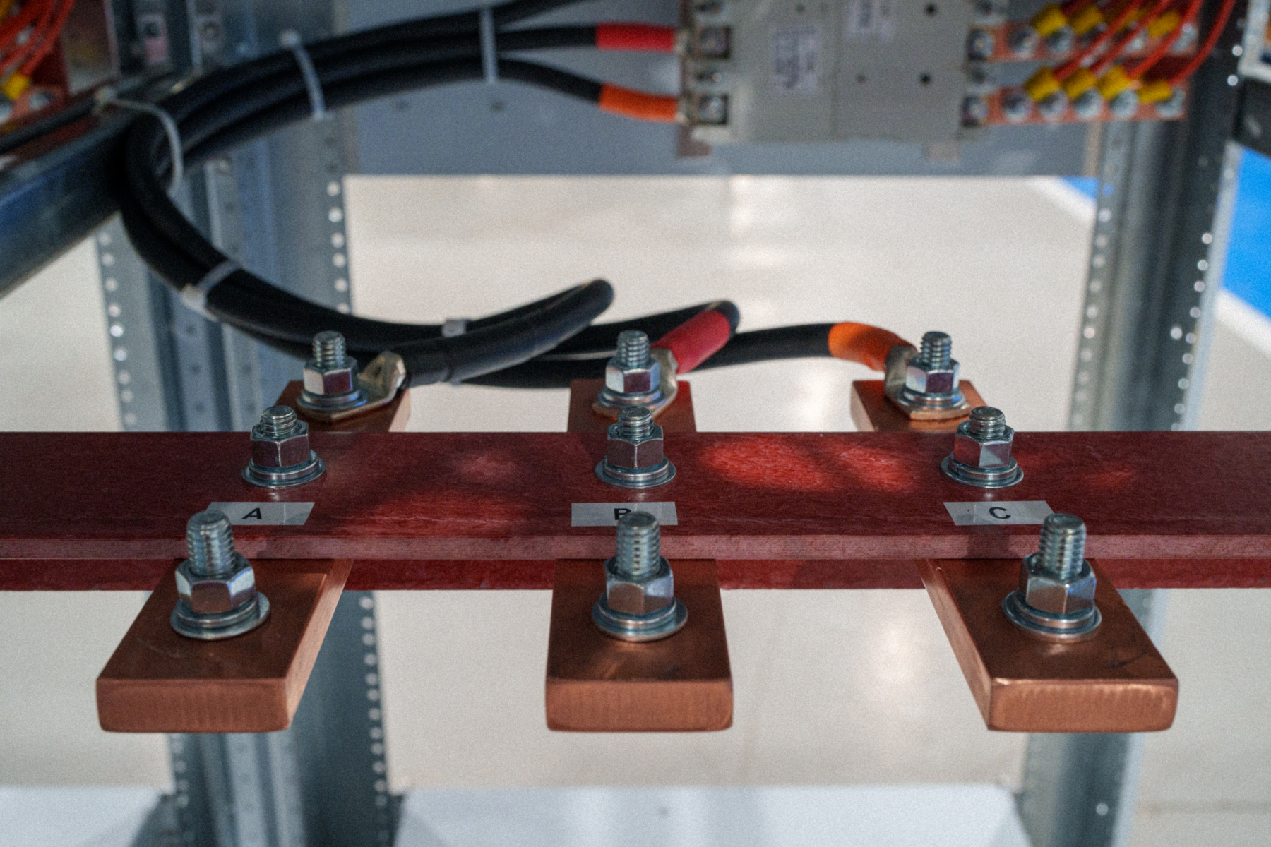 1.5" copper studs for customer connections to 3-phase facility power. Ground stud on mounting rail, not pictured.