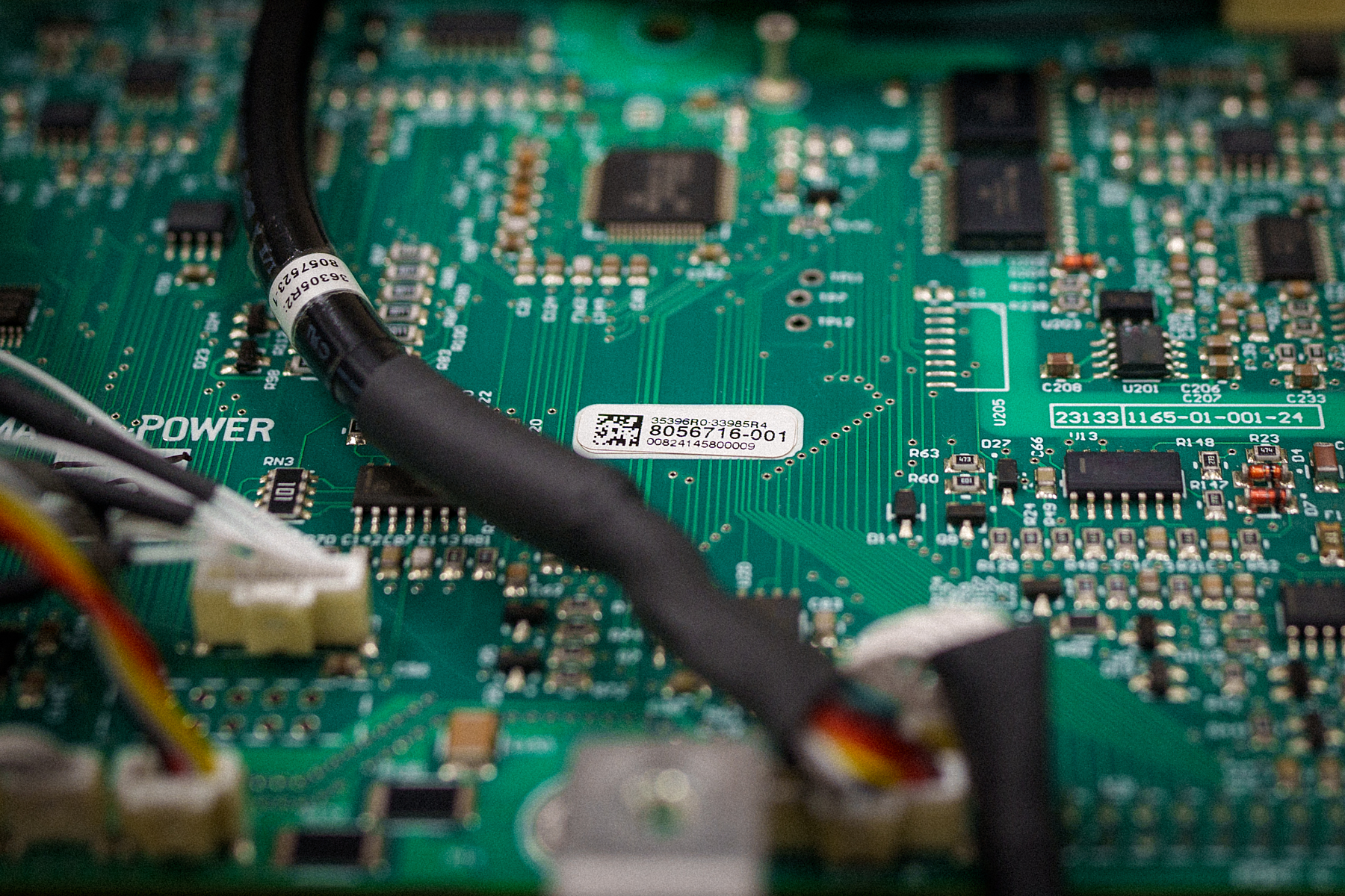 Example Magna-Power board and cable harness, showing labeling with item number, work order number, and QR code as part of a 3D automated optical inspection process