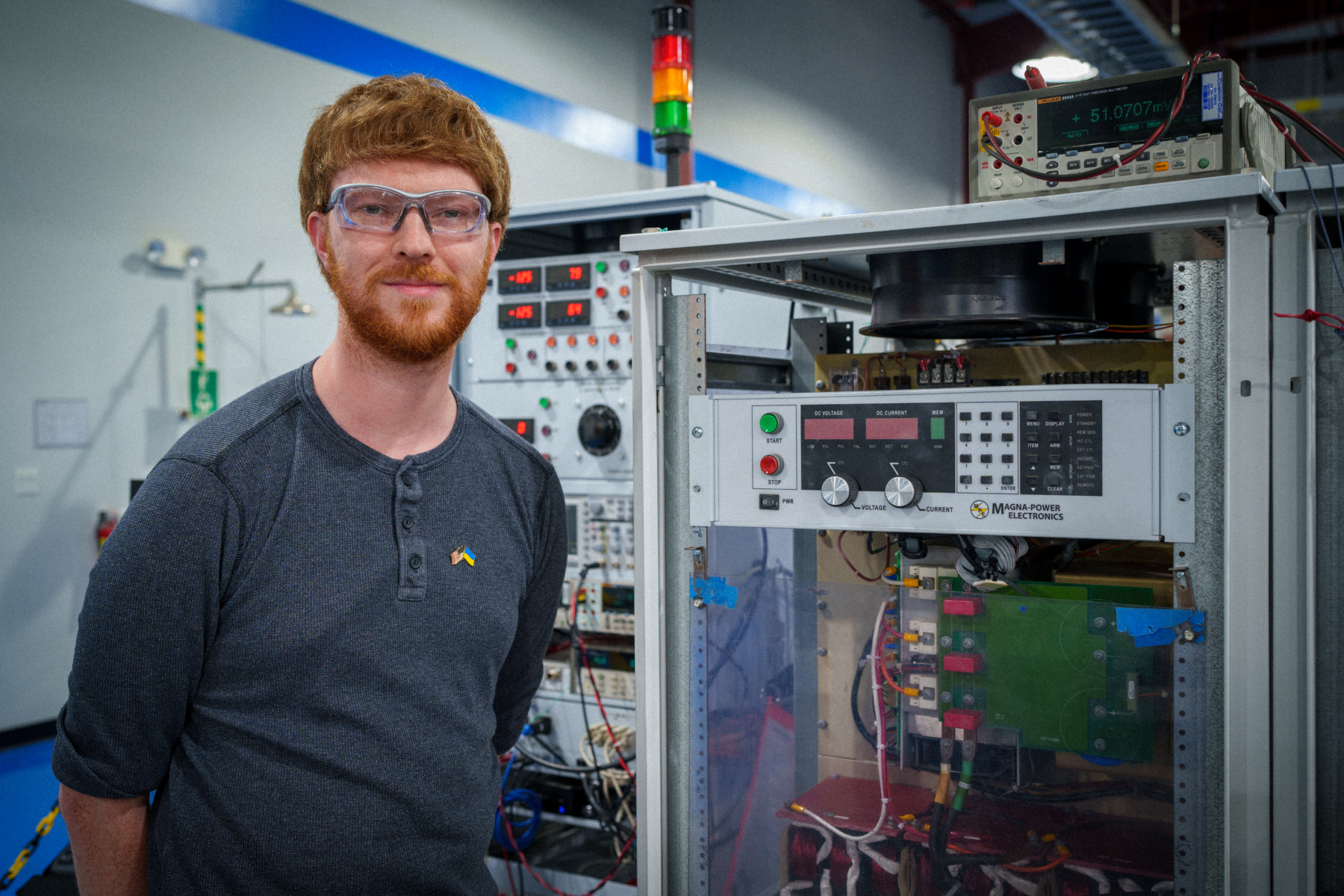 Magna-Power Product Support Technician, Nate Crabtree, performing factory acceptance testing on a 150 kW MT Series power supply repair