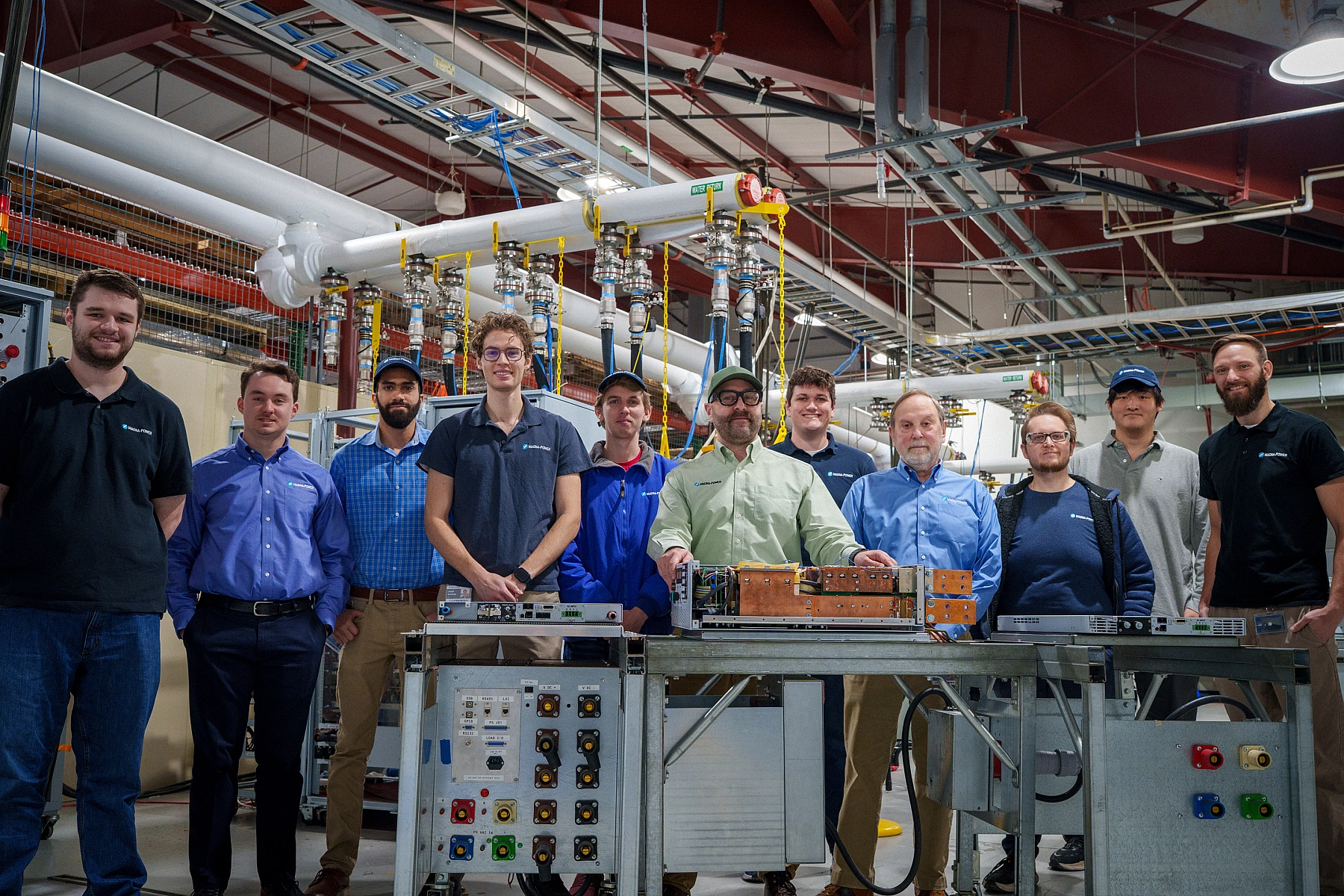 The Magna-Power engineering team and a selection of their 2025 introductions