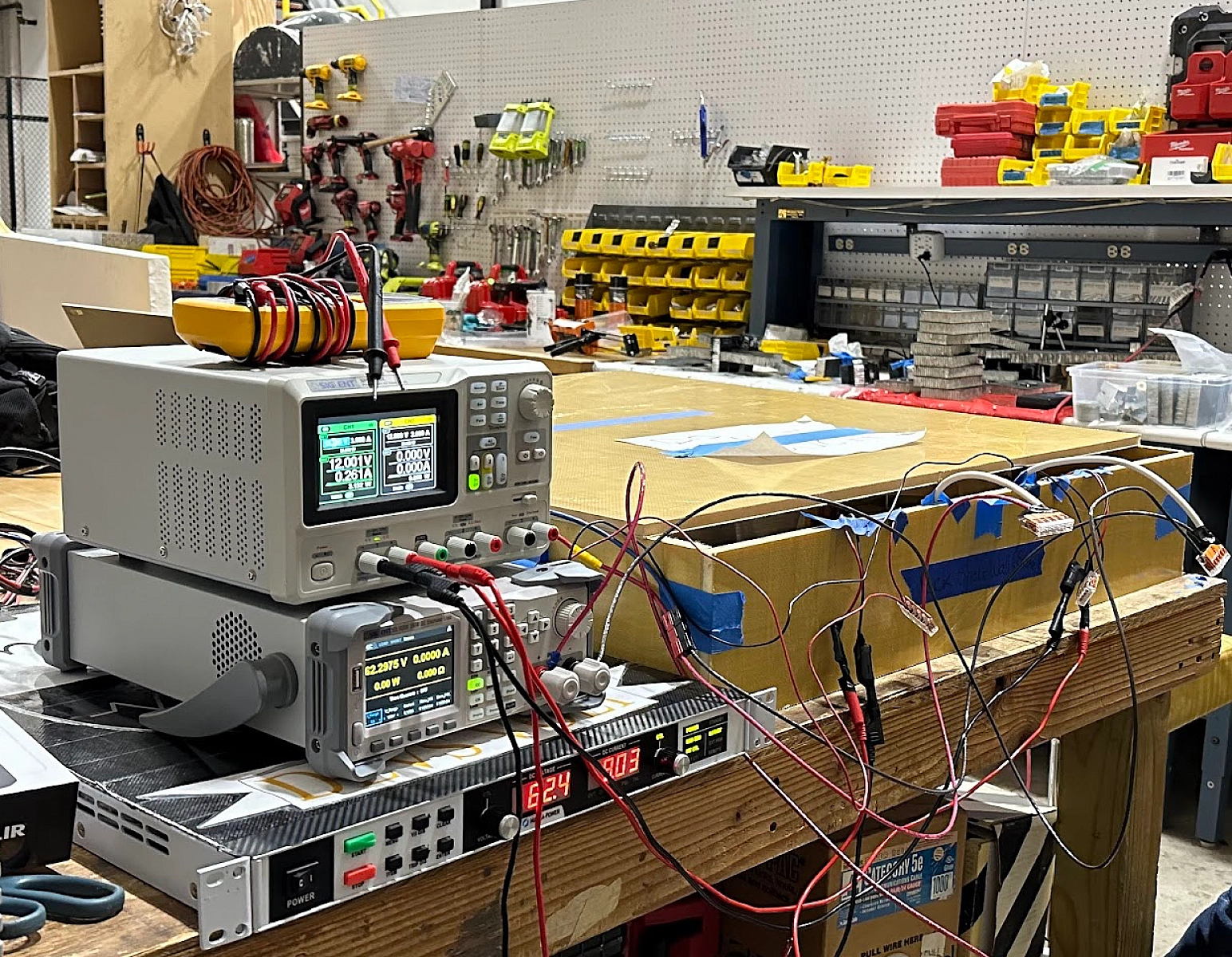 An SL Series power supply operating in constant-current (CC) mode is used to charge a custom-fabricated 18s64p lithium-ion battery pack, with other power supplies for the custom Battery Management System.
