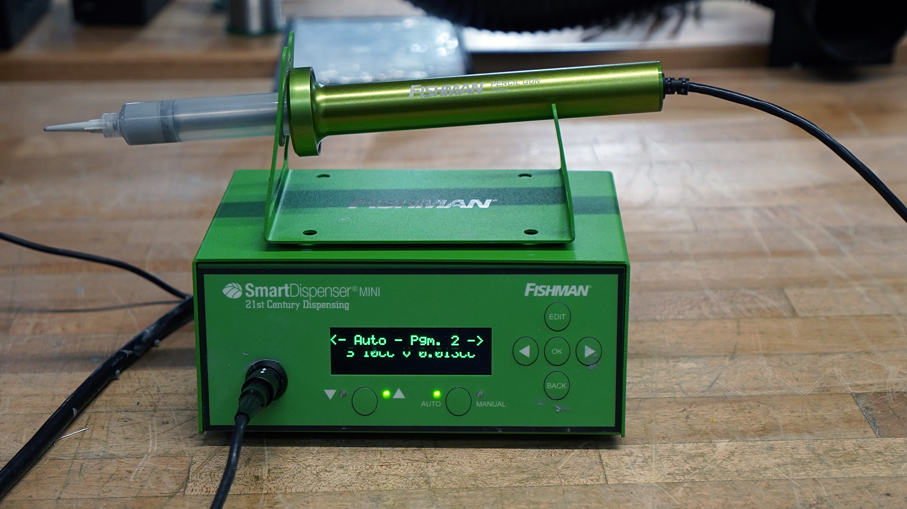 Fig 9. Example of Fishman positive displacement precision volume dispenser and dispensed Pitel Paste AZ-01 on TO-220 package.