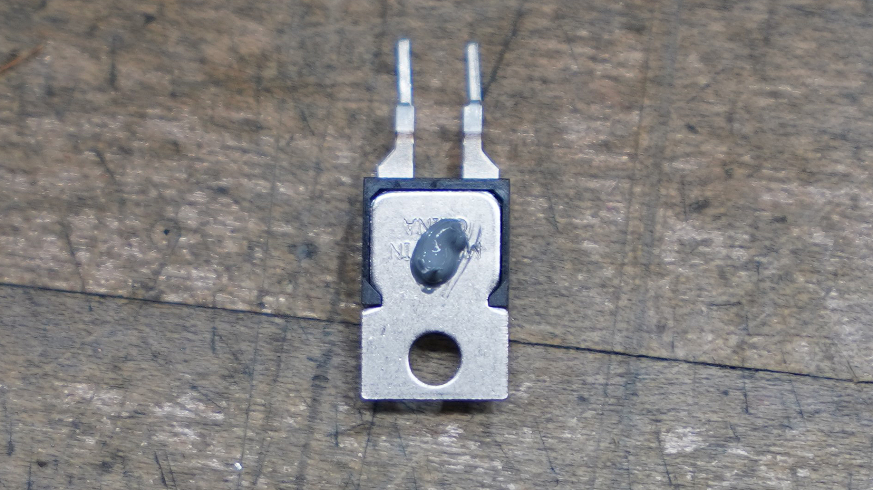 Fig 9. Example of Fishman positive displacement precision volume dispenser and dispensed Pitel Paste AZ-01 on TO-220 package.