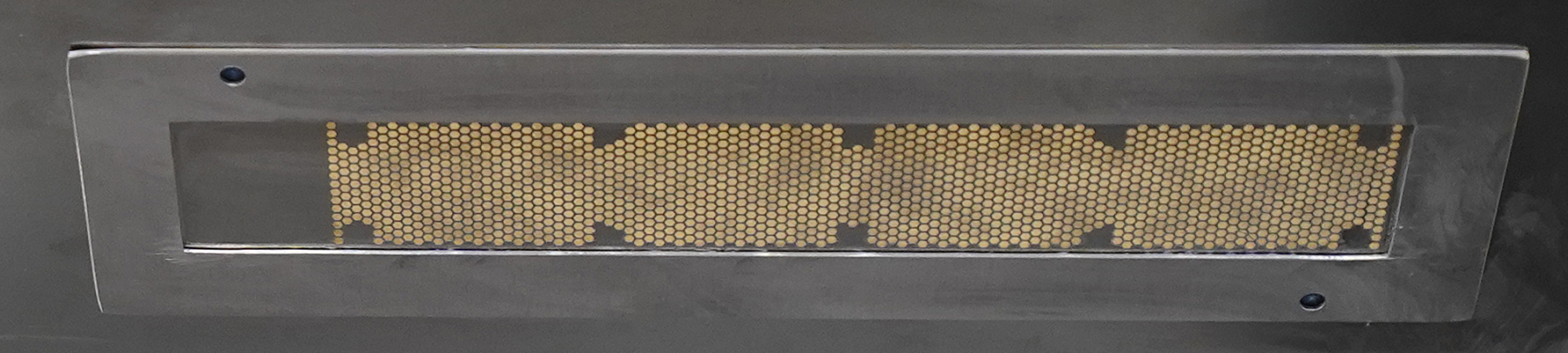 Fig 12. Bottom side of a stencil with a custom individual surround that positions the heatsink for printing.