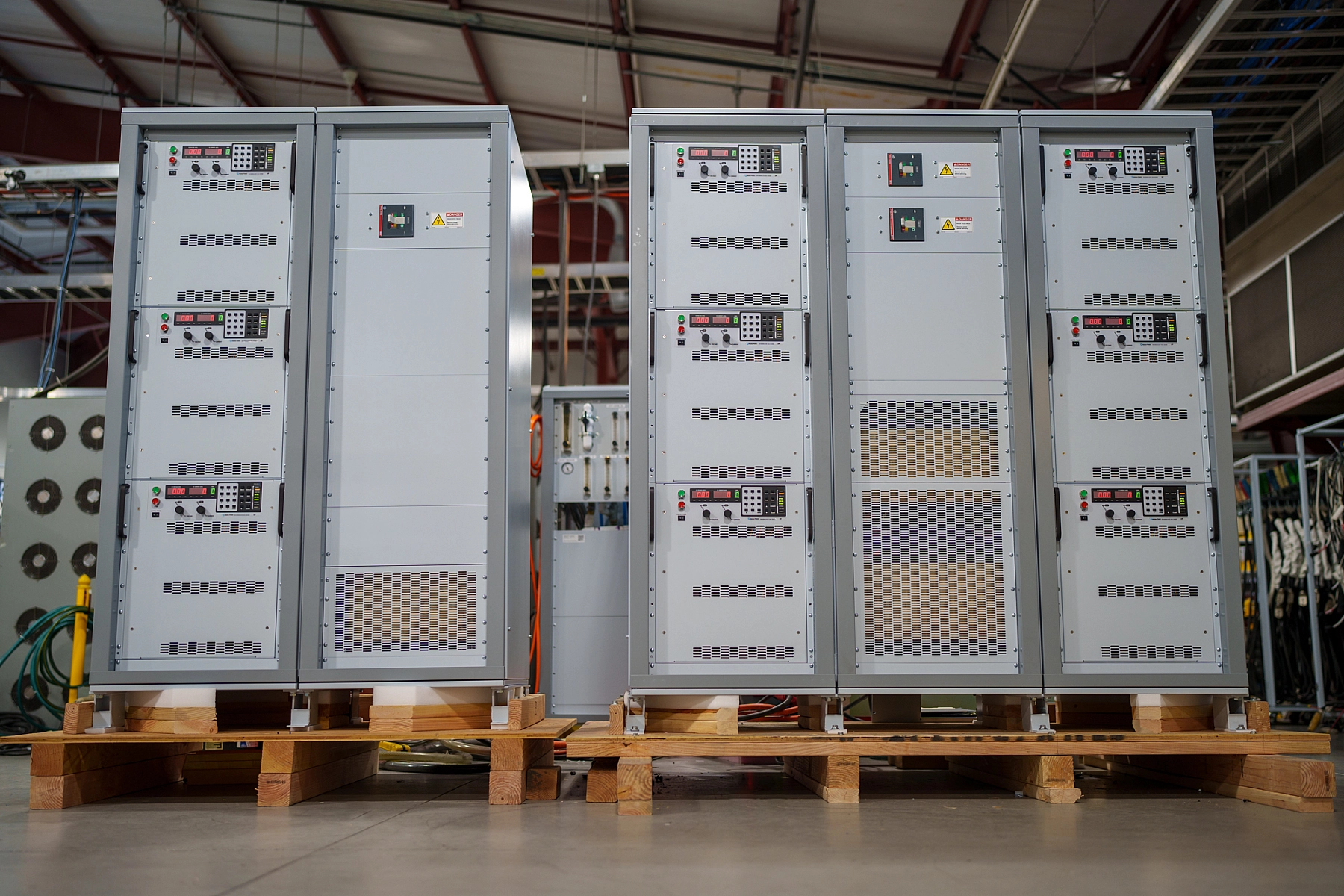 54 kA high current power supply system comprised of Qty (9) TSD10-6000/480+LXI+WC power supplies, rack enclosure and integration, AC breakers, and harmonic neutralizers.
