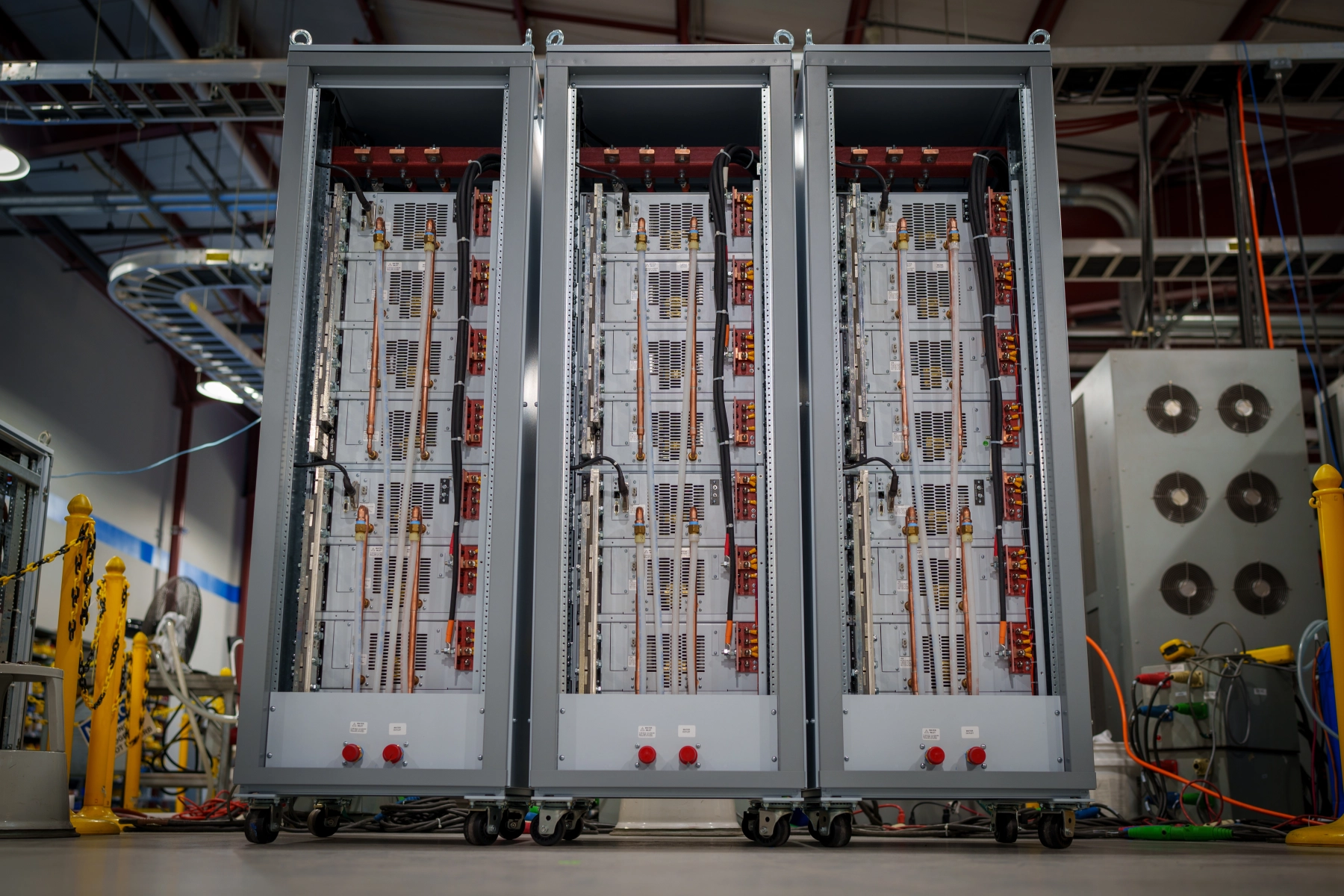 30,000 Adc water cooled TS Series in Magna-Power rack enclosures with manifolding to a common inlet and outlet.
